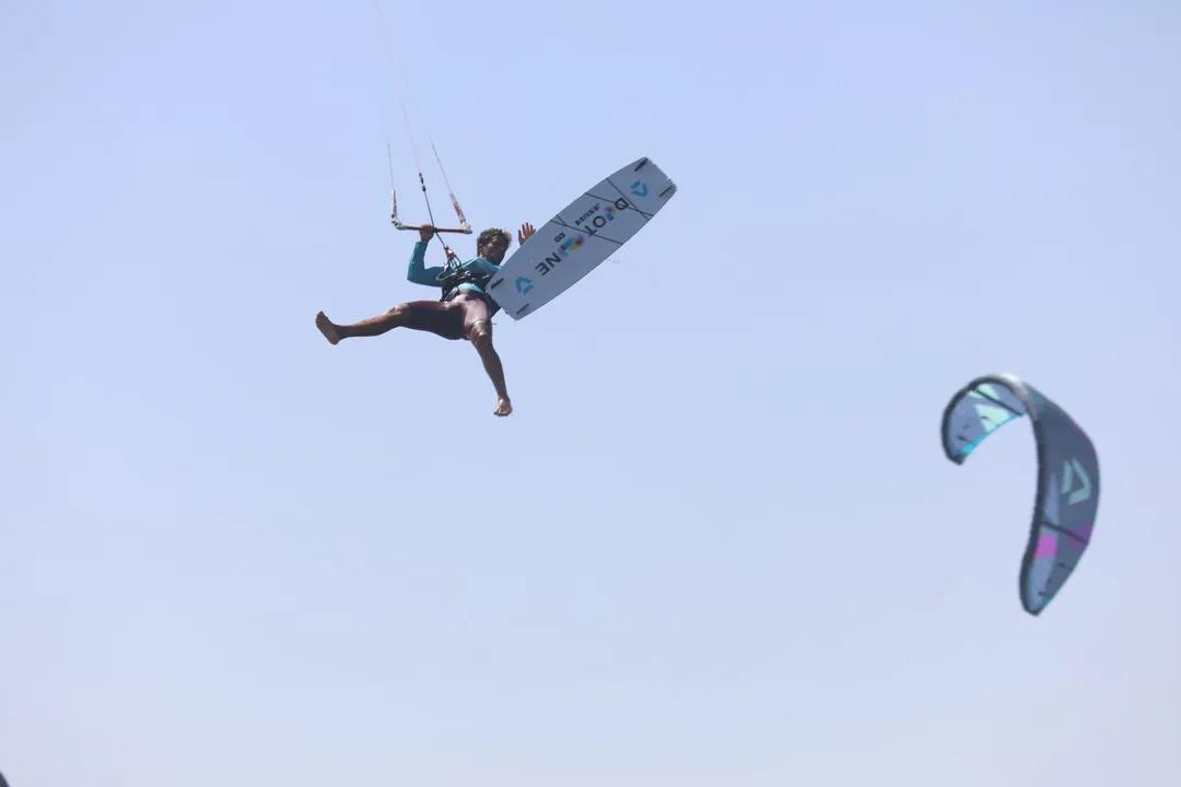 Freestyle kitesurf jump in Essaouira — rider grabbing the board over the water with Windy Essaouira
